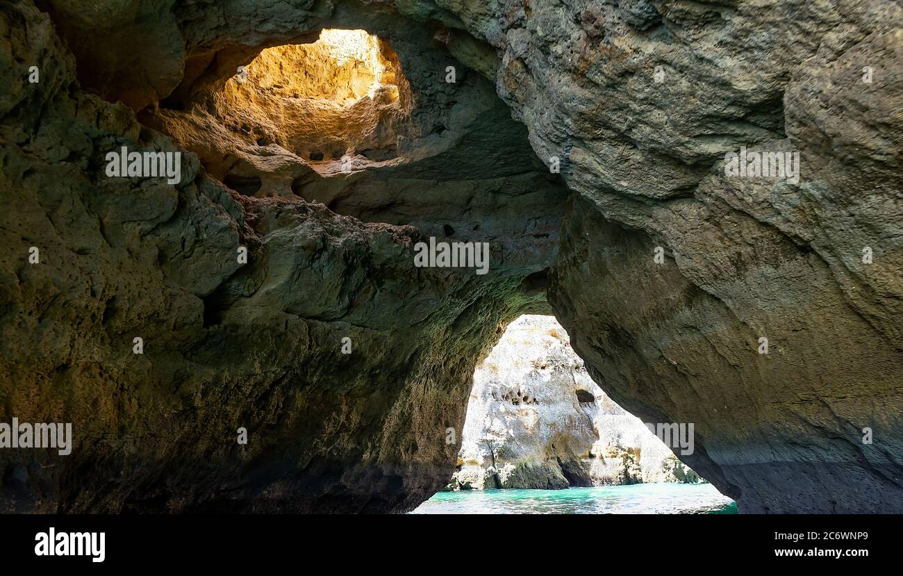 Albufeira, Portugal - July 11, 2020: A group of tourist in a boat visiting the caves of Benagil Stock Photo