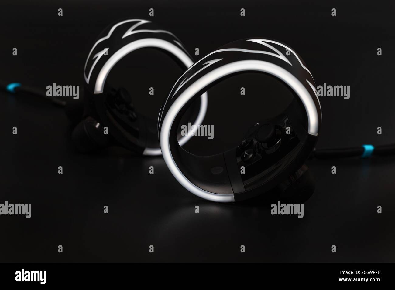 Virtual reality controllers with led light on black background Stock Photo