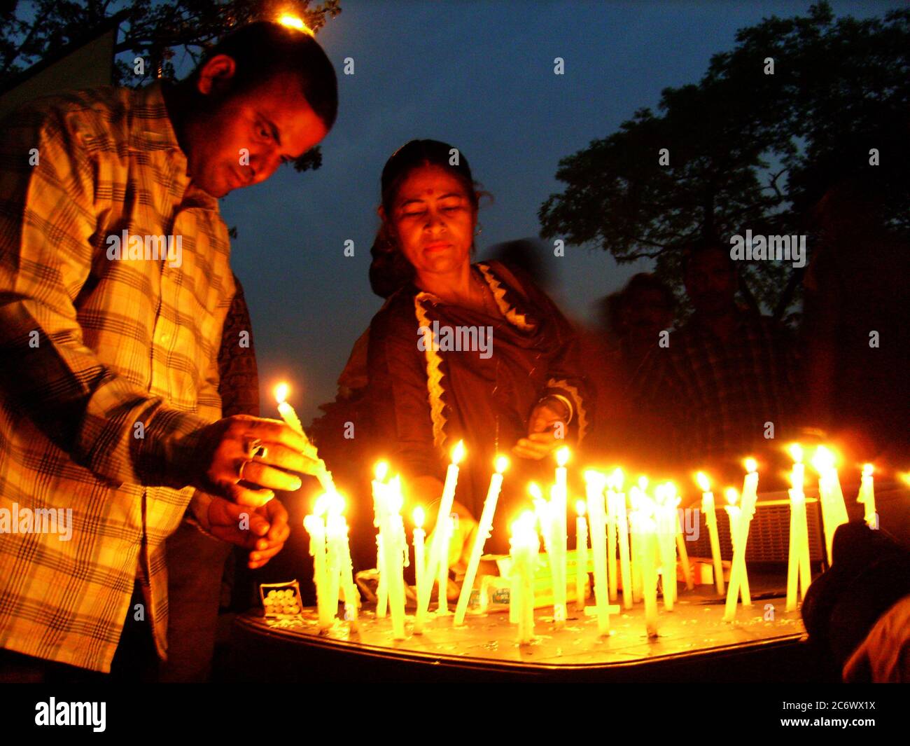 A rally with candles, against the brutality in Nandigram, at a street, in Kolkata, India. November 14, 2007. In 2007 the West Bengal government decided to allow ‘Salim Group’, an Indonesian conglomerate, to set up a chemical hub at Nandigram under the ‘Special Economic Zone’, SEZ, policy. This led to resistance by the villagers resulting in clashes with the police that left 14 dead and accusation of police brutality. Source: www.wikipedia.com Stock Photo