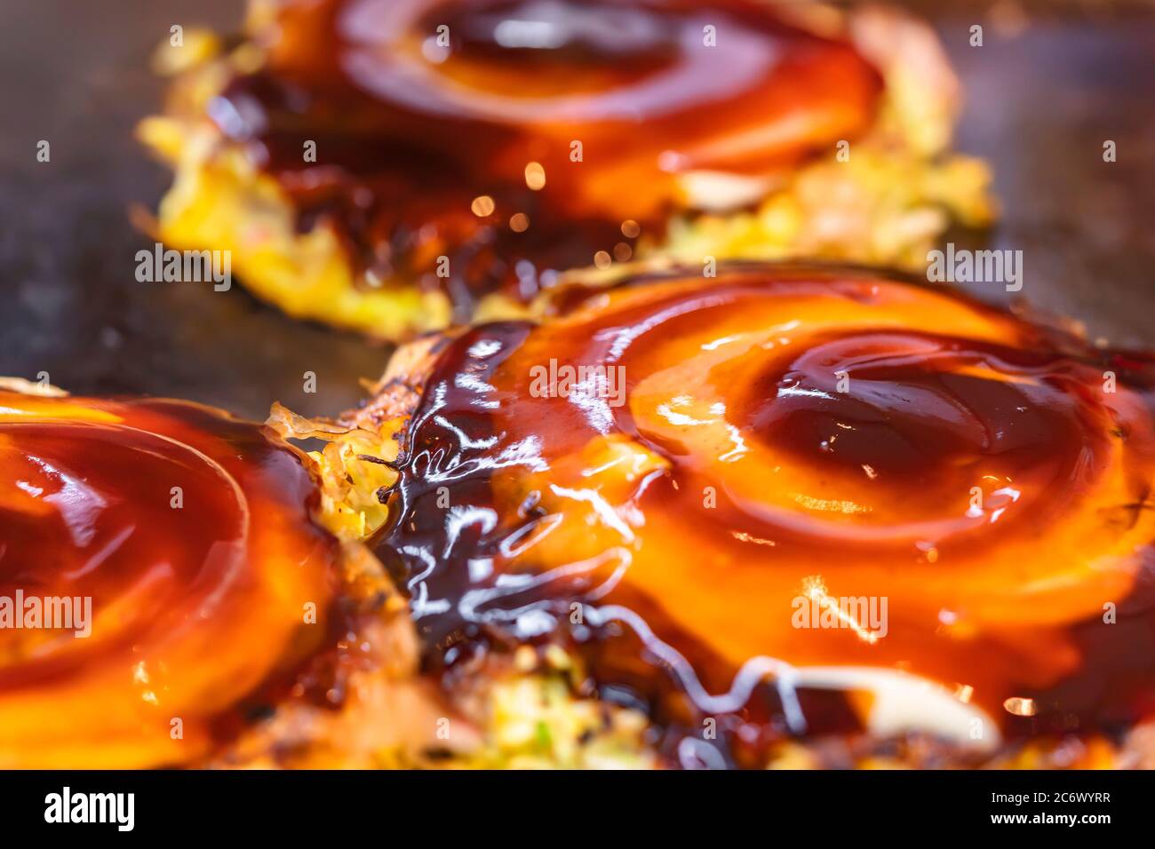 Closeup on an okonomiyaki Japanese omelet, which means cooked to your
