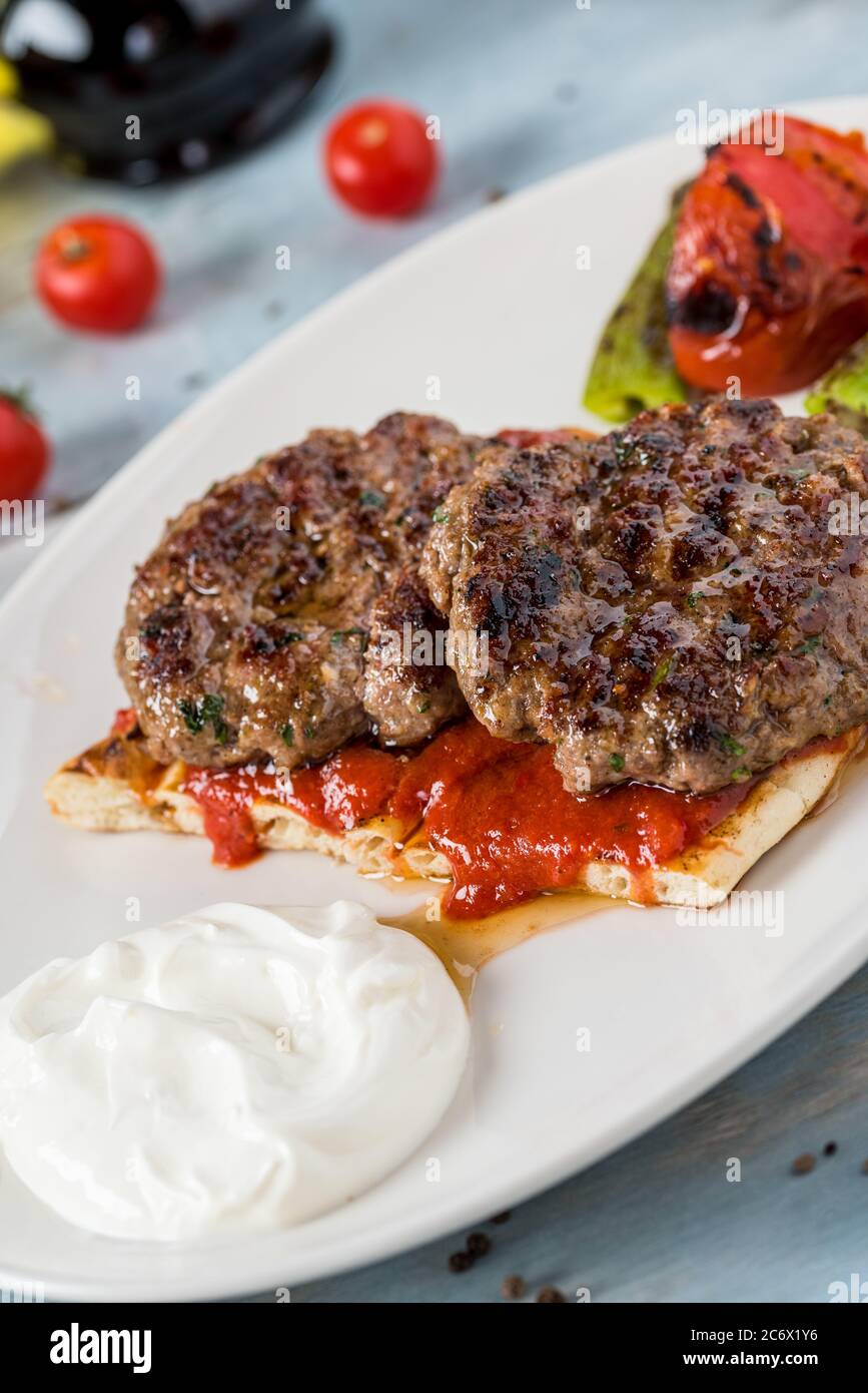 Turkish traditional kofte. Spicy meatballs Kebab or Kebap. Stock Photo