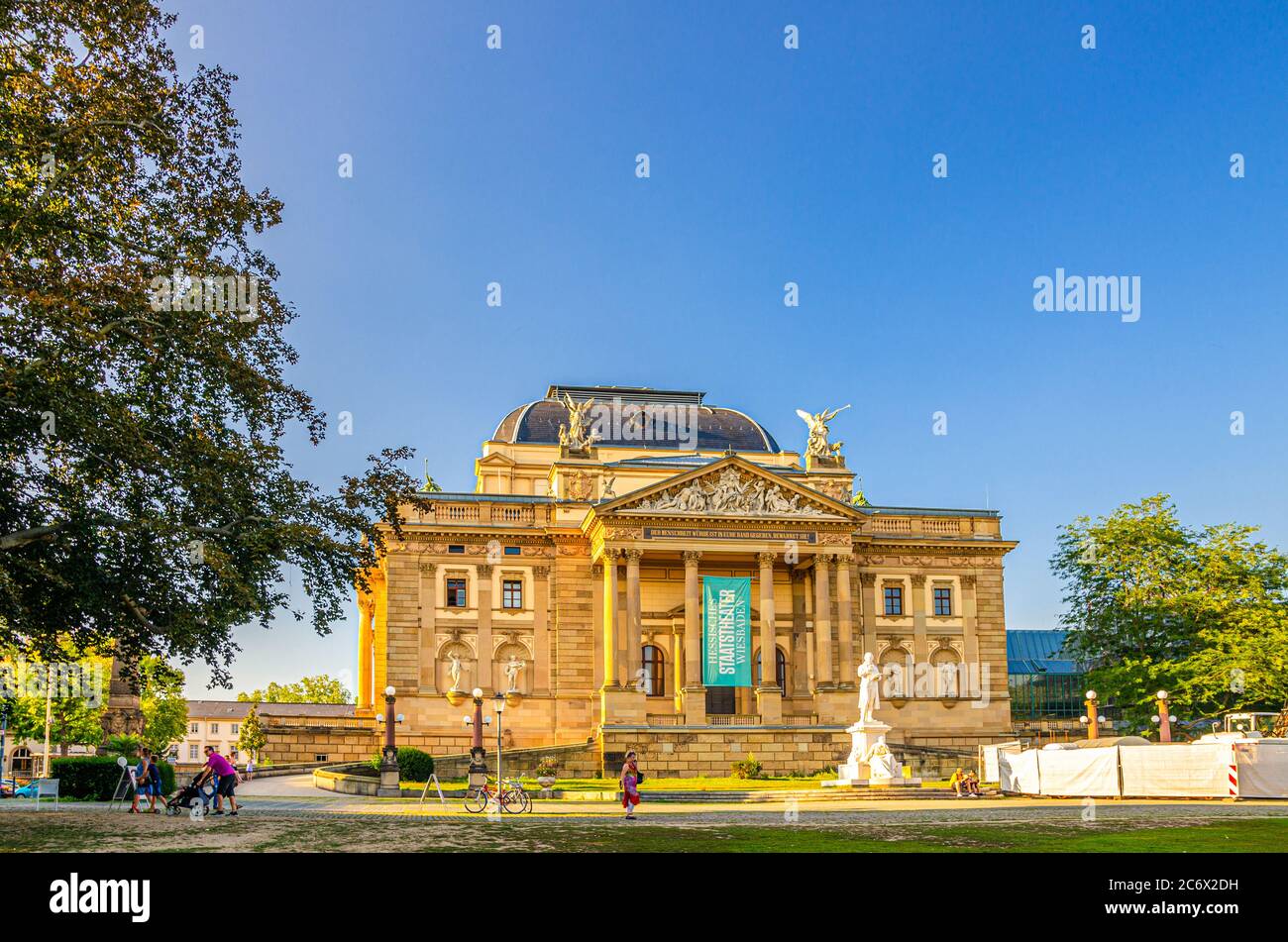 Wiesbaden, Germany, August 24, 2019: Hessisches Staatstheater State Theatre building with columns in historical city centre, blue sky background, State of Hesse Stock Photo