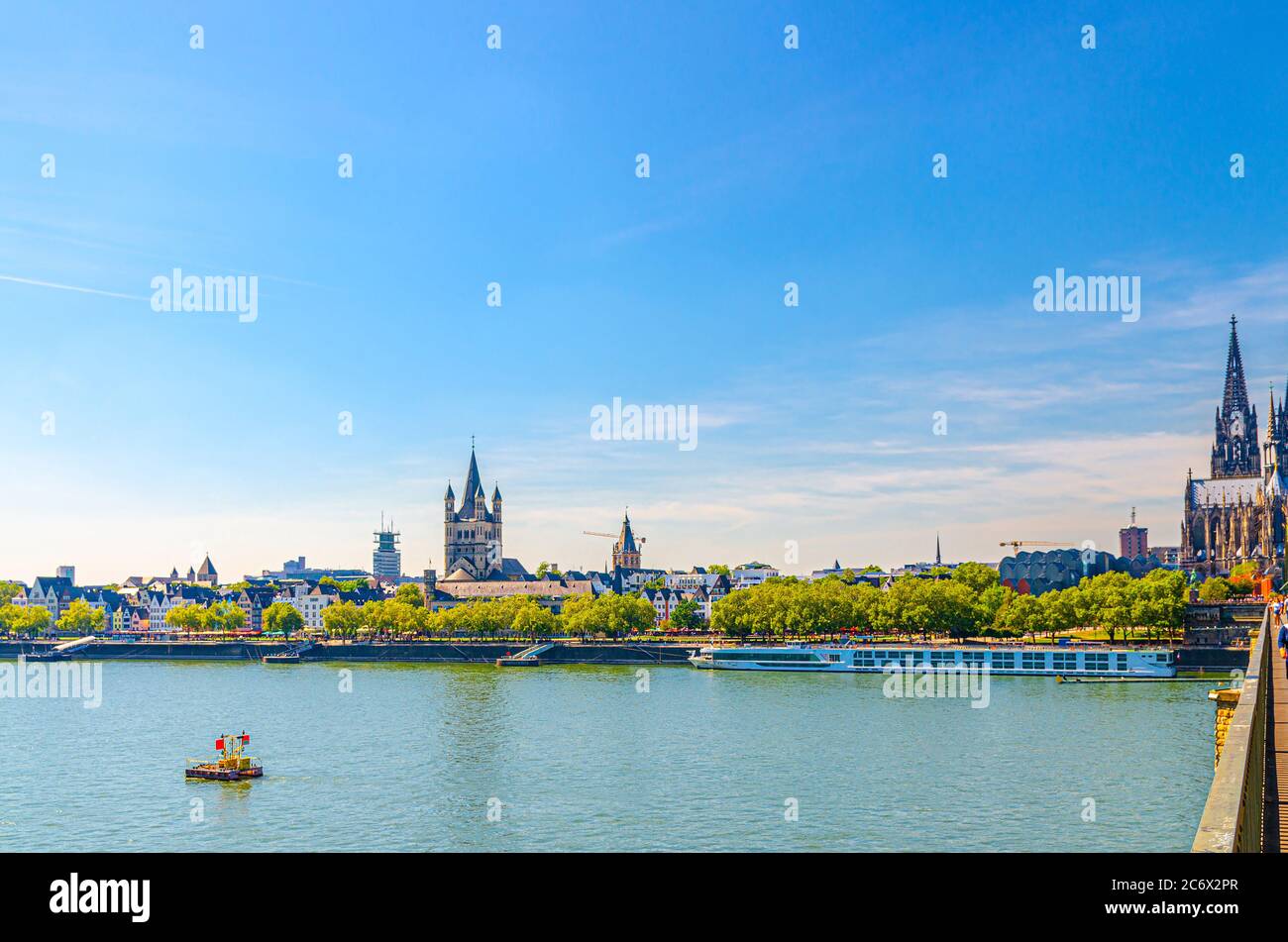 Cologne cityscape of historical city centre with Cologne Cathedral of Saint Peter, Great Saint Martin Roman Catholic Church buildings and embankment of Rhine river, North Rhine-Westphalia, Germany Stock Photo