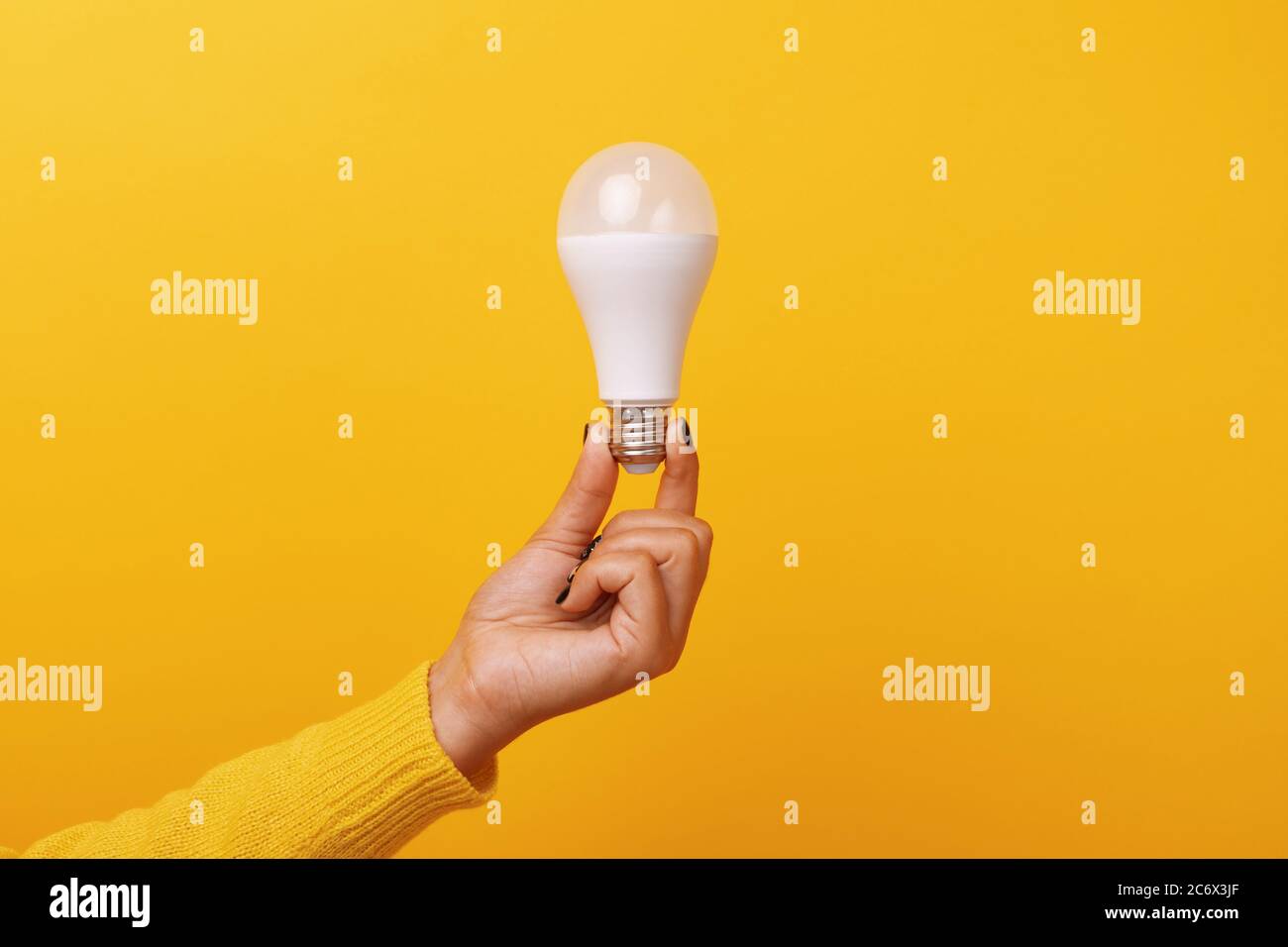 Light bulb over yellow hi-res stock photography and images - Alamy
