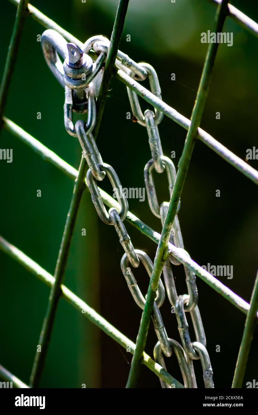 A Silver Chained Linked Fence Stock Photo
