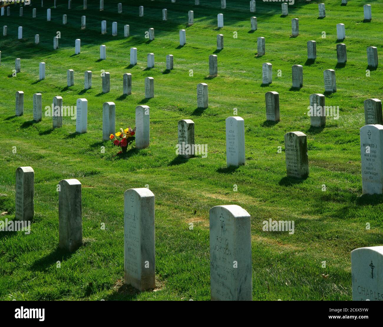 Arlington VA/APRIL A single floral bouquet deco rates rows of gravestones at Arlington National