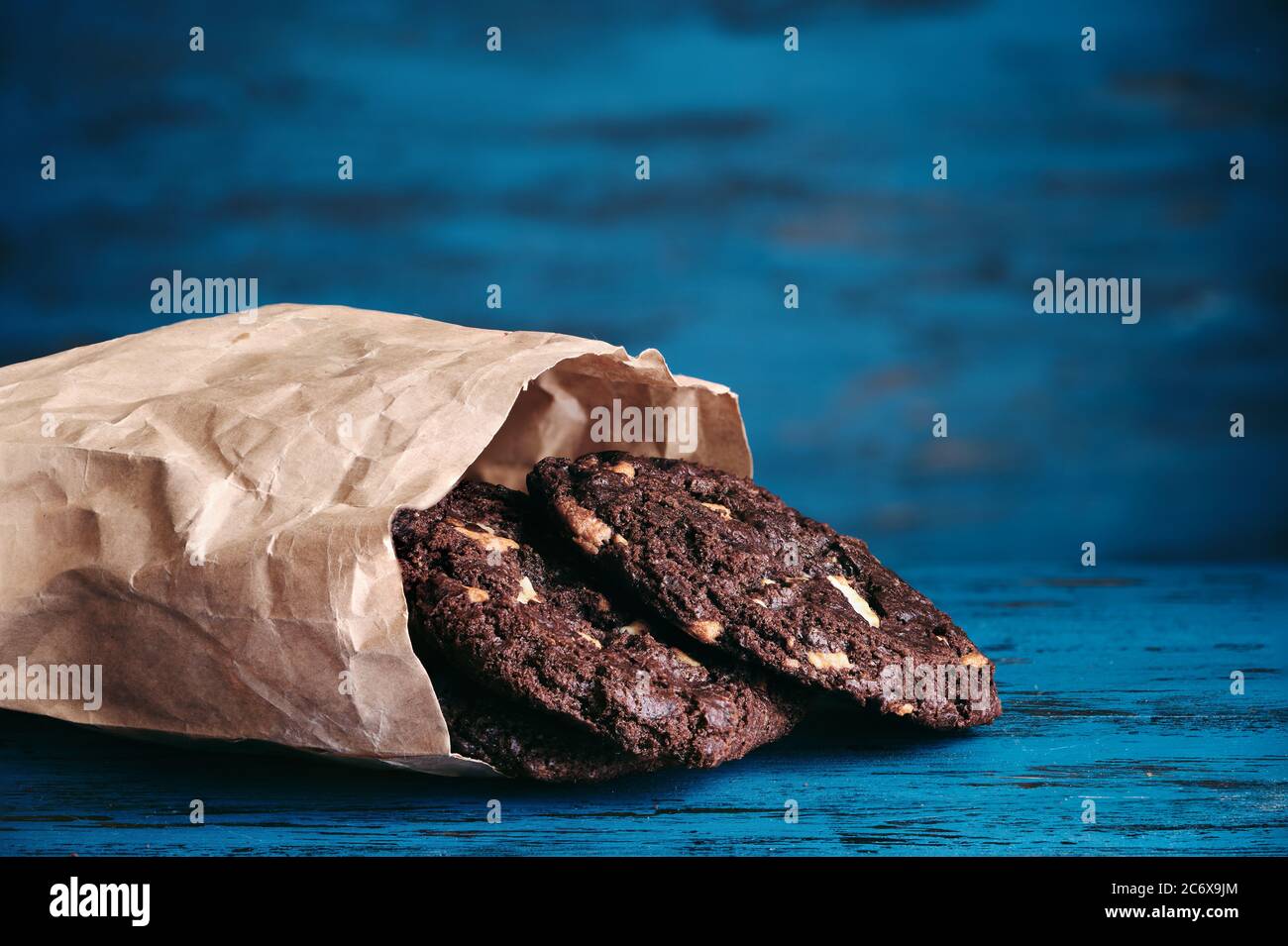 Chokolate cookies on blue wooden background. Stock Photo