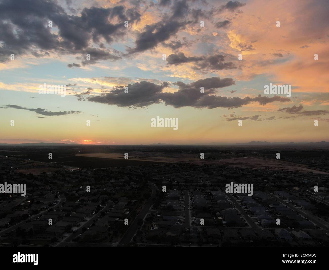 Aerial image of a community neighborhood in Arizona as the sun is setting. Stock Photo