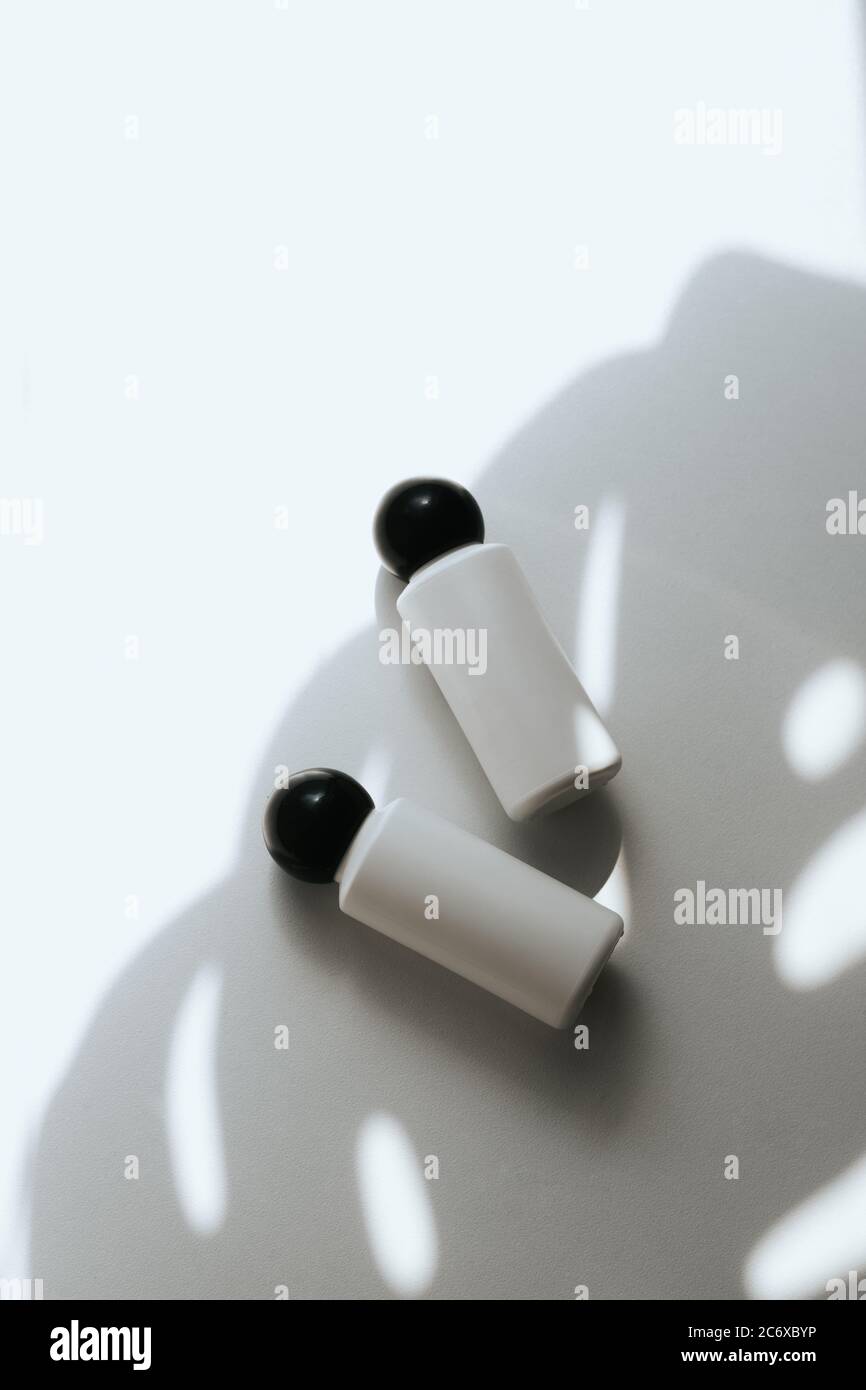 Two white empty plastic bottles on a white background Stock Photo - Alamy