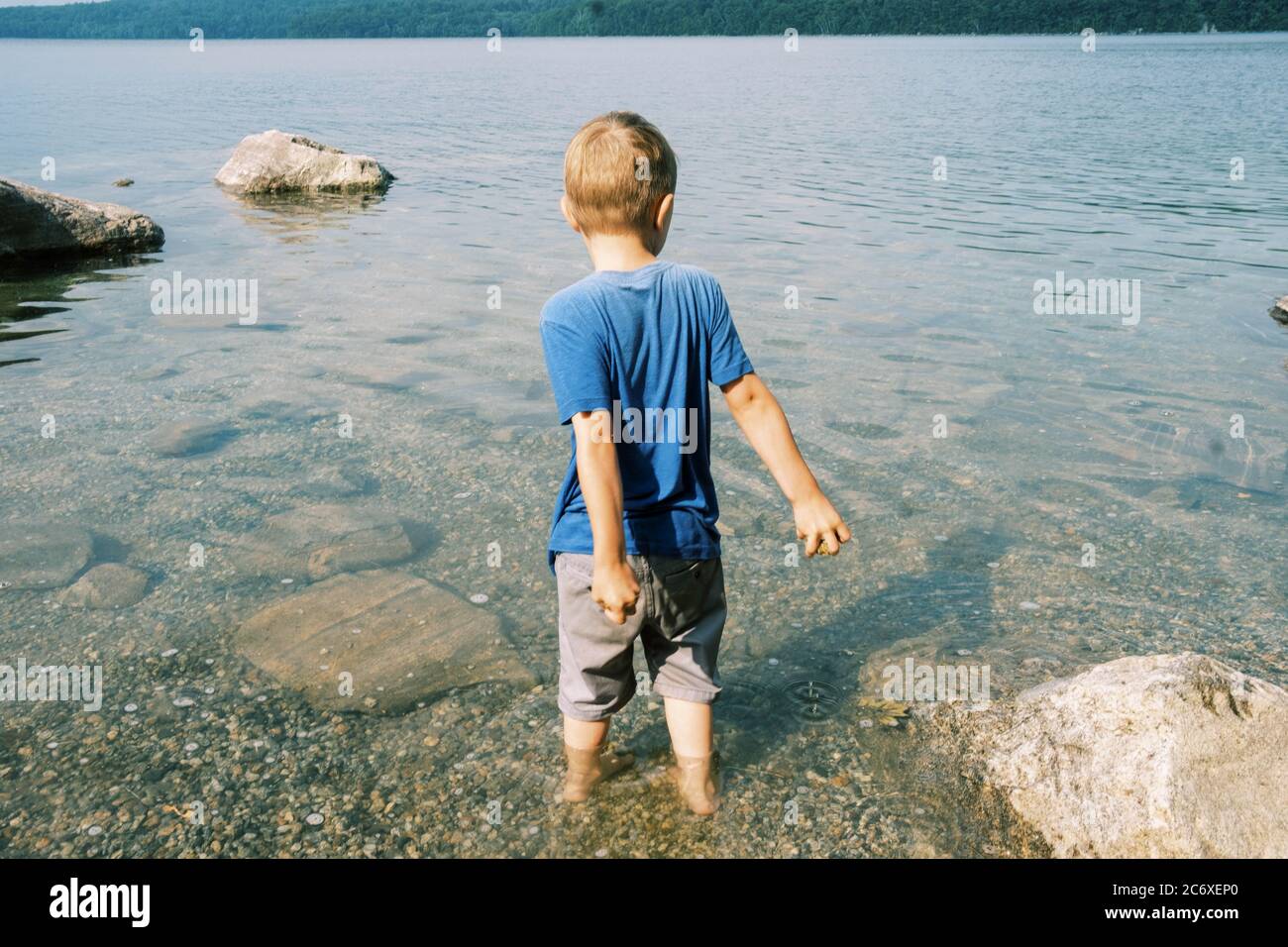 Throwing rocks into the water hires stock photography and images Alamy