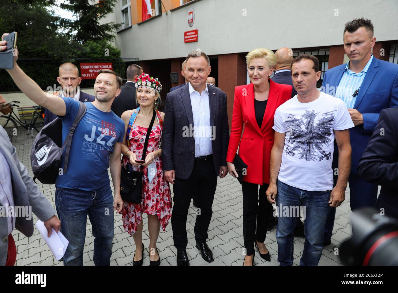 Polish presidential couple Andrzej Duda and Agata Kornhauser-Duda pose for a photo with their supporters after voting.  The incumbent President of Pol Stock Photo