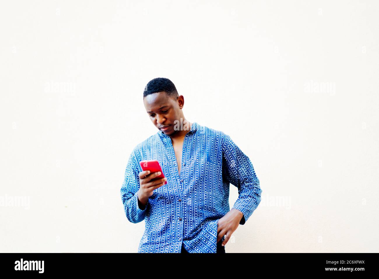 young african man using his smartphone Stock Photo