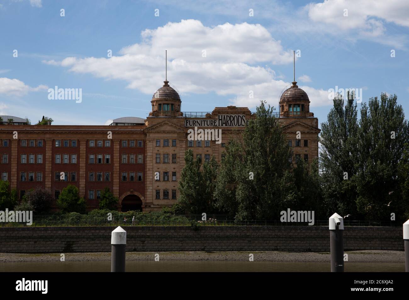 The Harrods Furniture Depository buildings on the south bank of the River Thames near Hammersmith Bridge in Barnes, London SW13 Stock Photo