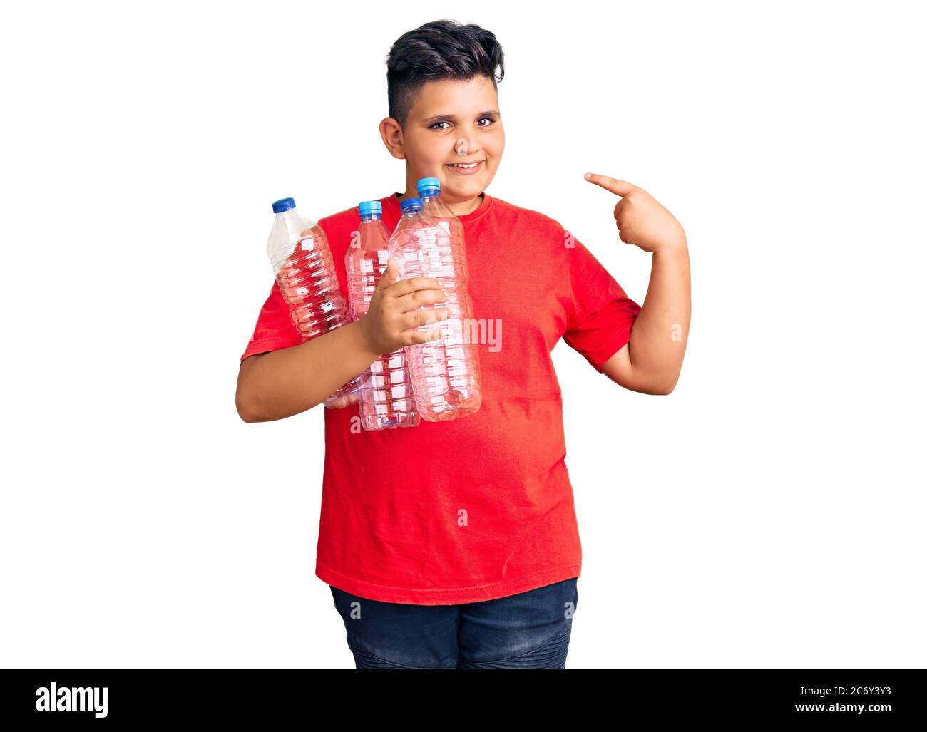 Little boy kid holding recycling plastic bottles pointing finger to one ...