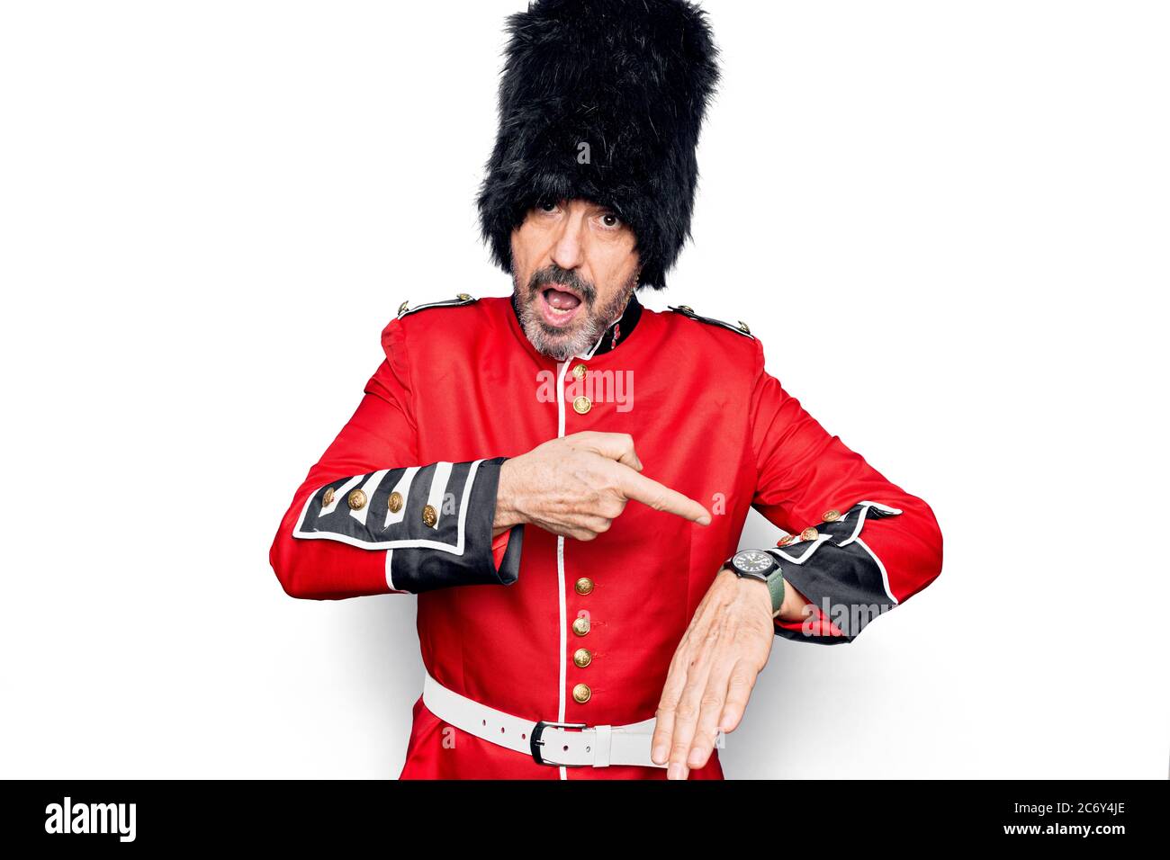 Middle age handsome wales guard man wearing traditional uniform over ...