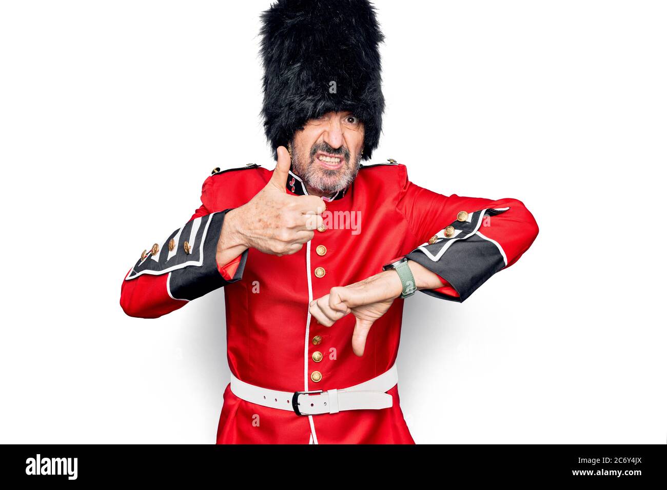 Middle age handsome wales guard man wearing traditional uniform over ...