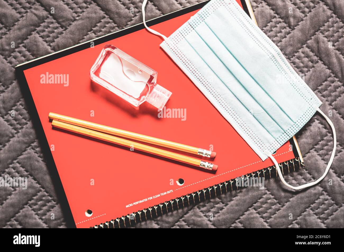 Essential school supplies for the new normal include face mask and hand sanitizer Stock Photo