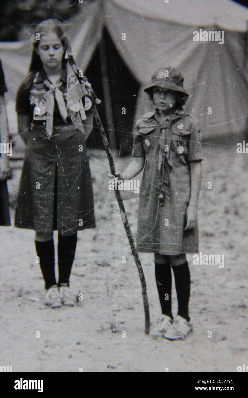 Fine 70s vintage black and white lifestyle photography of girls hanging out in summer scout camp. Stock Photo