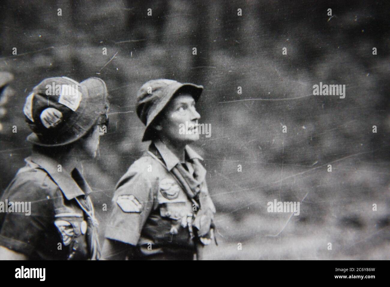 Fine 70s vintage black and white lifestyle photography of scout leader looking up. Stock Photo