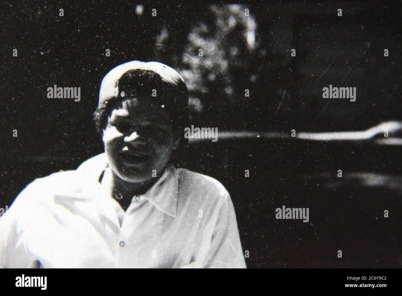 Fine 70s vintage black and white lifestyle photography of a friendly neighbor enjoying the traditional American block party in full swing. Stock Photo