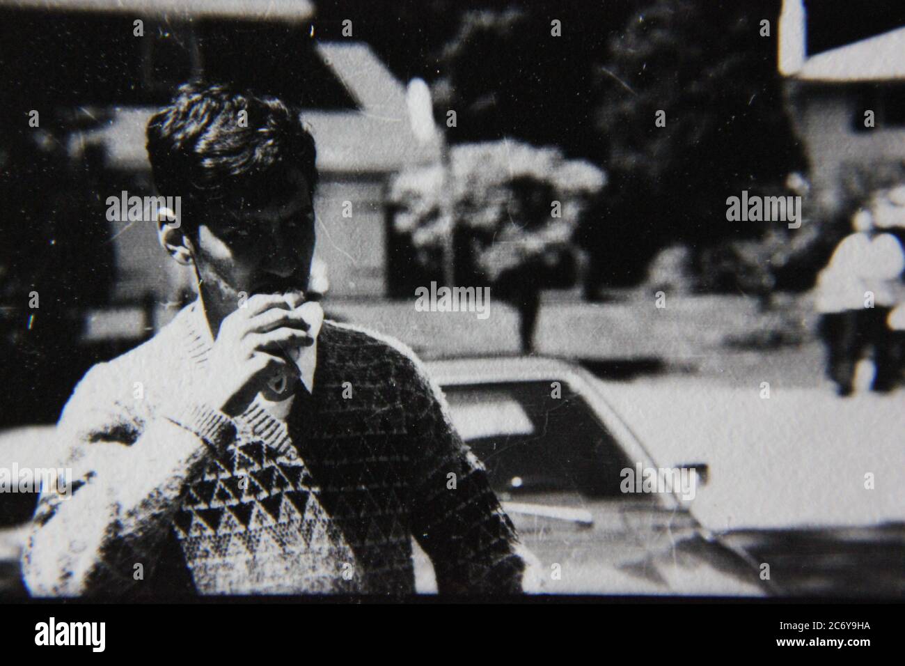 Fine 70s vintage black and white lifestyle photography of a young teenager enjoying himself on a warm summer day. Stock Photo