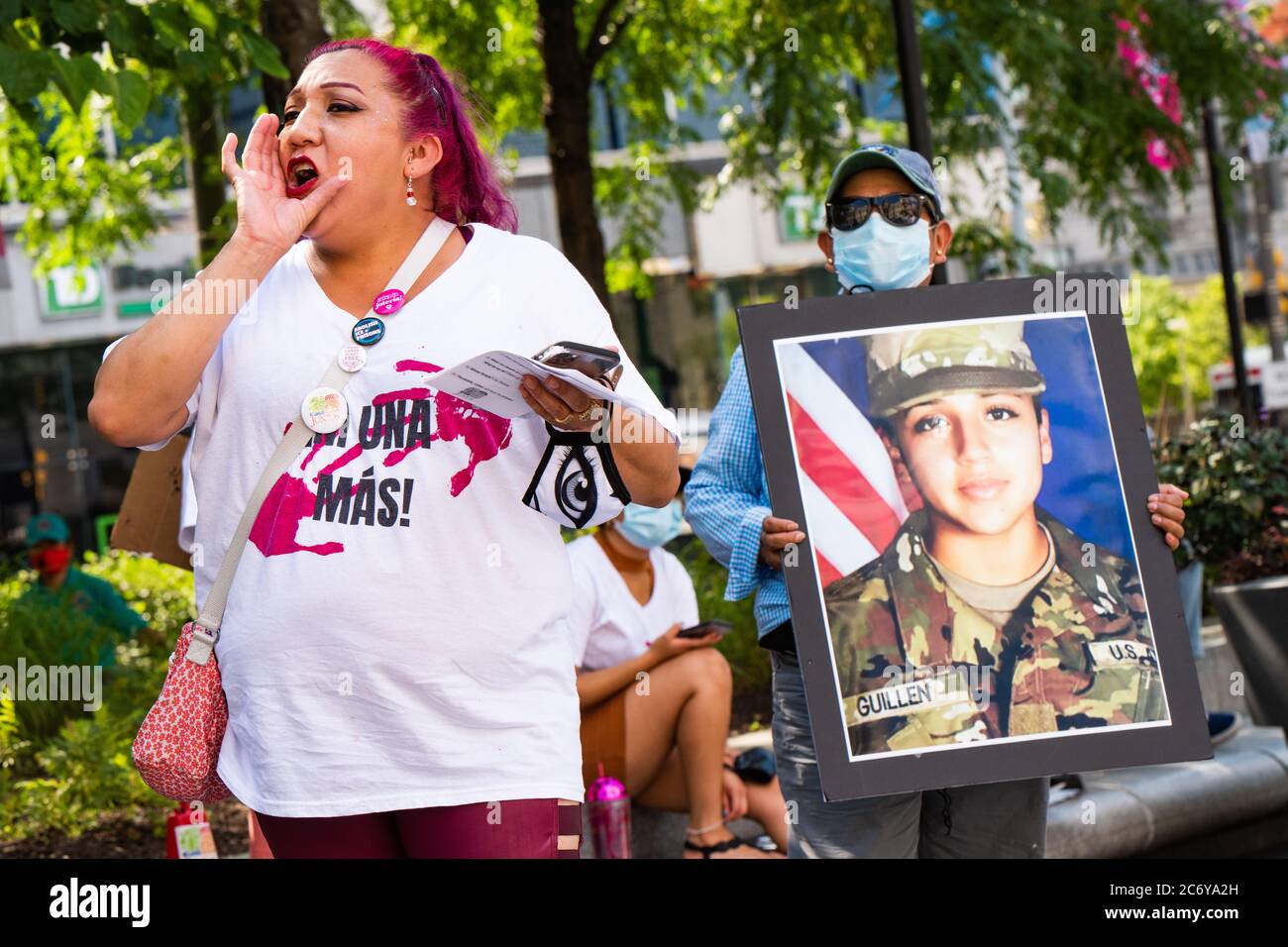 Philadelphia / USA. A woman calls out to a crowd standing in front of an enlarged photgraph of slain US service member Vanessa Guillen at a protest organized by Philadephia Latinx organizatoin, Juntos.  July 12, 2020. Credit: Christopher Evens / Alamy Live News Stock Photo