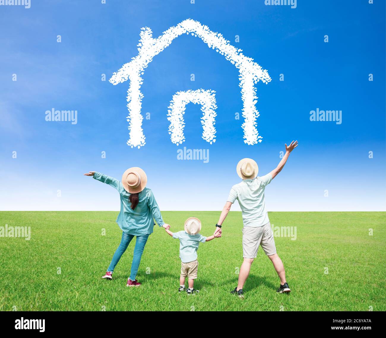 happy  family watching the sky with home and house symbol concept Stock Photo
