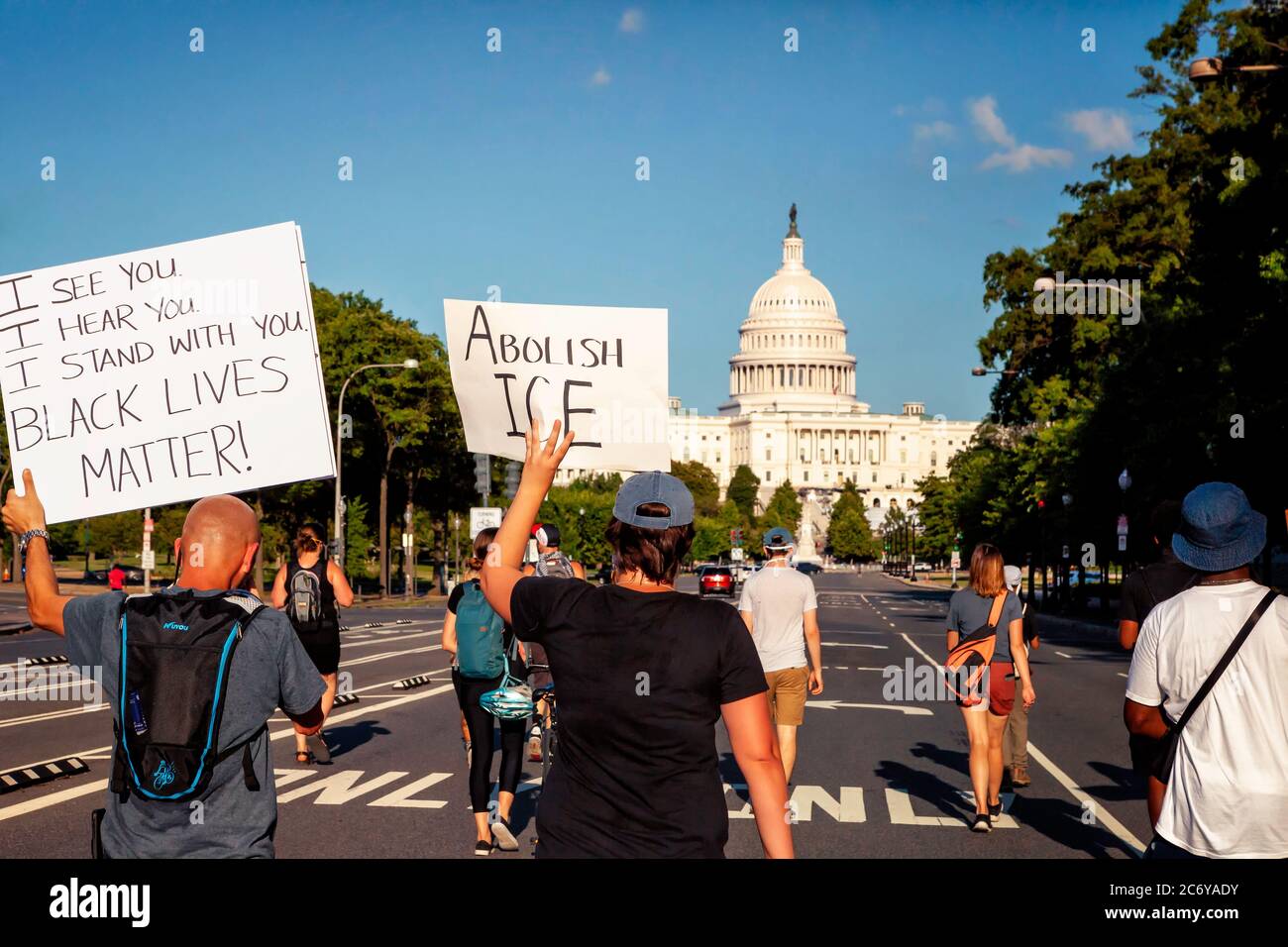 Protesters with signs march for black lives and immigrant down Pennsylvania Avenue toward the Capitol, Washington, DC, United States Stock Photo