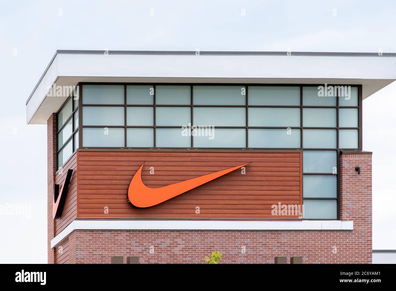 Clarksburg, Maryland / USA - July 12 2020: Sign at the exterior storefront of Nike Factory Store at Clarksburg Premium Outlets in Maryland. Stock Photo
