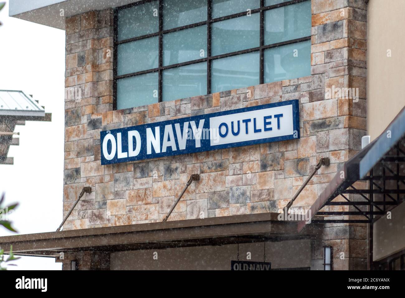 Clarksburg, Maryland / USA - July 12 2020: Rainy sign at the exterior storefront of Old Navy Outlet at Clarksburg Premium Outlets in Maryland. Stock Photo