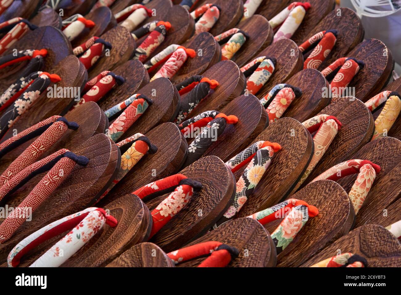 KYOTO, JAPAN - OCTOBER 22, 2007: The colorful female japanese wooden rounded sandals (zori), made of silk, exposed on the counter at the market of Kyo Stock Photo