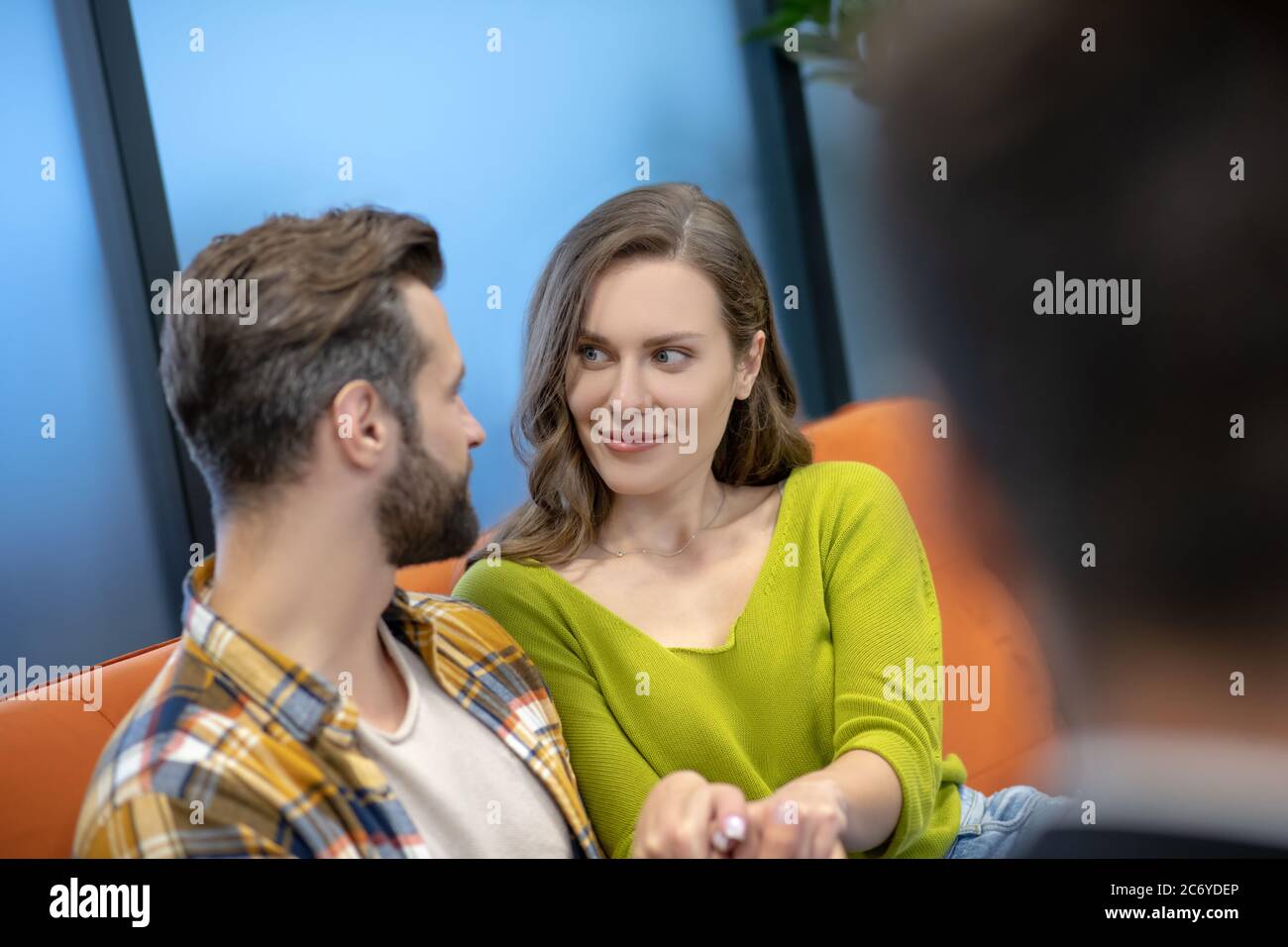 A young family talking about their relations Stock Photo