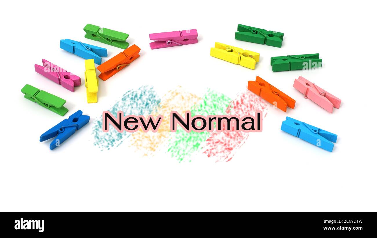 New normal text with colorful clips isolated on white background. Stock Photo