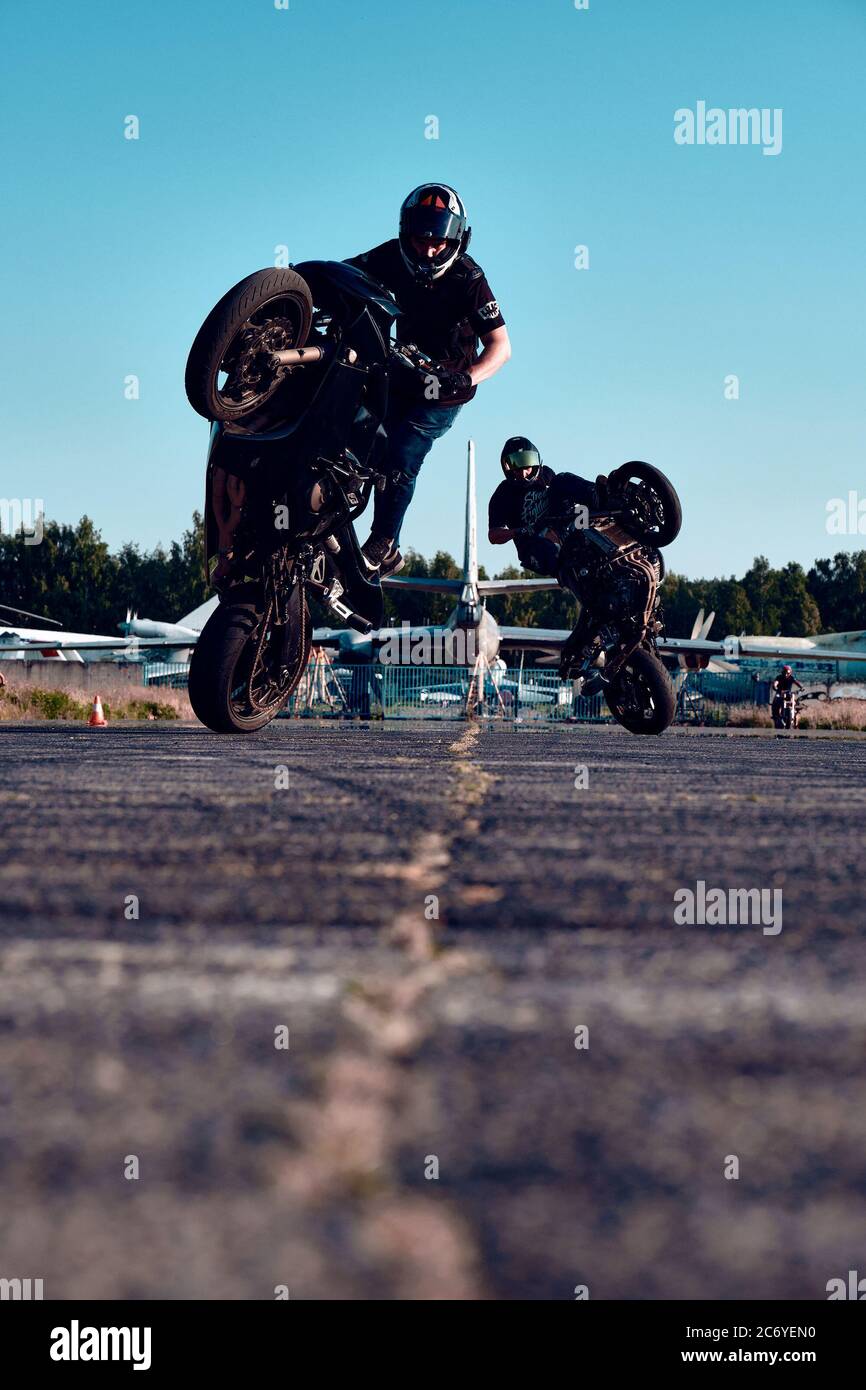 Free Photo  Moto rider making a stunt on his motorbike biker