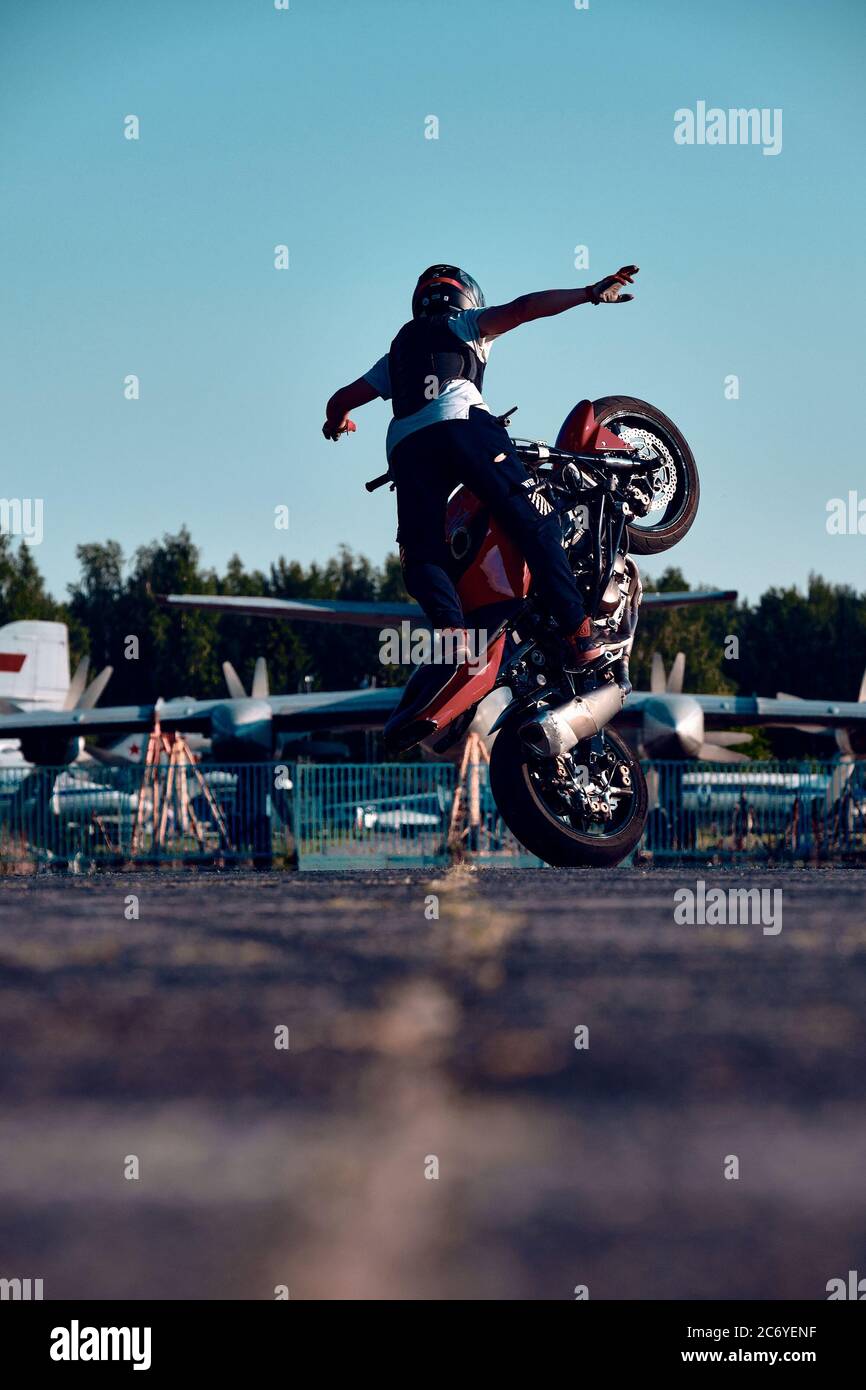 Moscow, Russia - 12 Jul 2020: Moto rider making a stunt on his motorbike.  Stunt motorcycle rider performing motorcycle show Stock Photo - Alamy