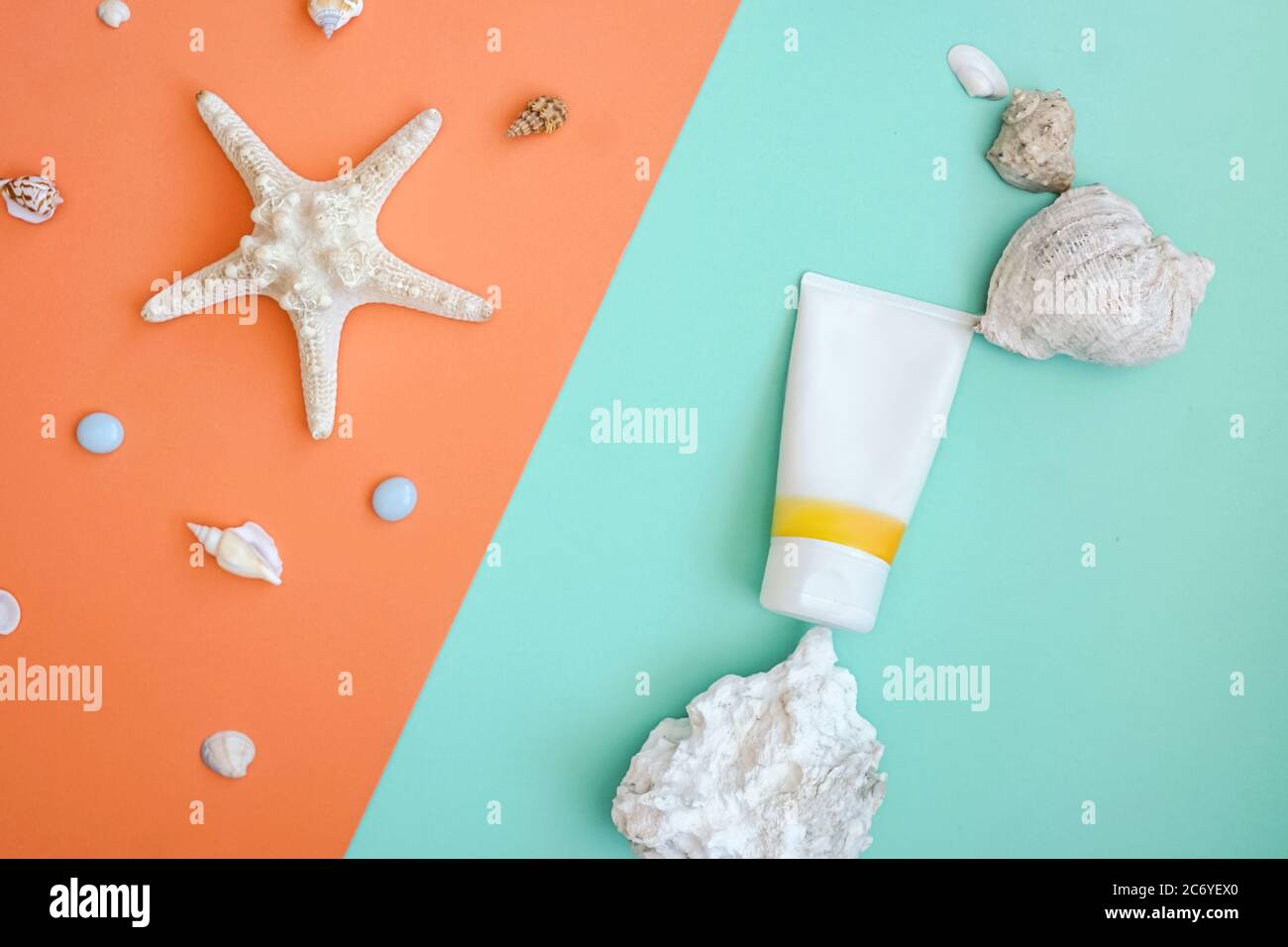 Sunscreen as part of natural composition from shell, stone. Flat lay on ...