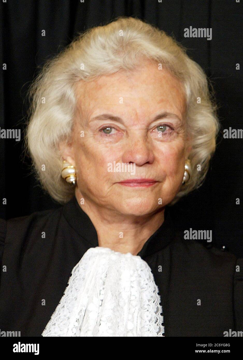 Associate Justice of the United States Supreme Court Sandra Day O'Connor poses during a group portrait session with the members of the US Supreme Court, at the Supreme Court Building in Washington, DC on December 5, 2003. O'Connor made history as the first woman on the high court when former US President Ronald Reagan nominated her.  She took her seat September 25, 1981. Credit: Mark Wilson / Pool via CNP / MediaPunch Stock Photo