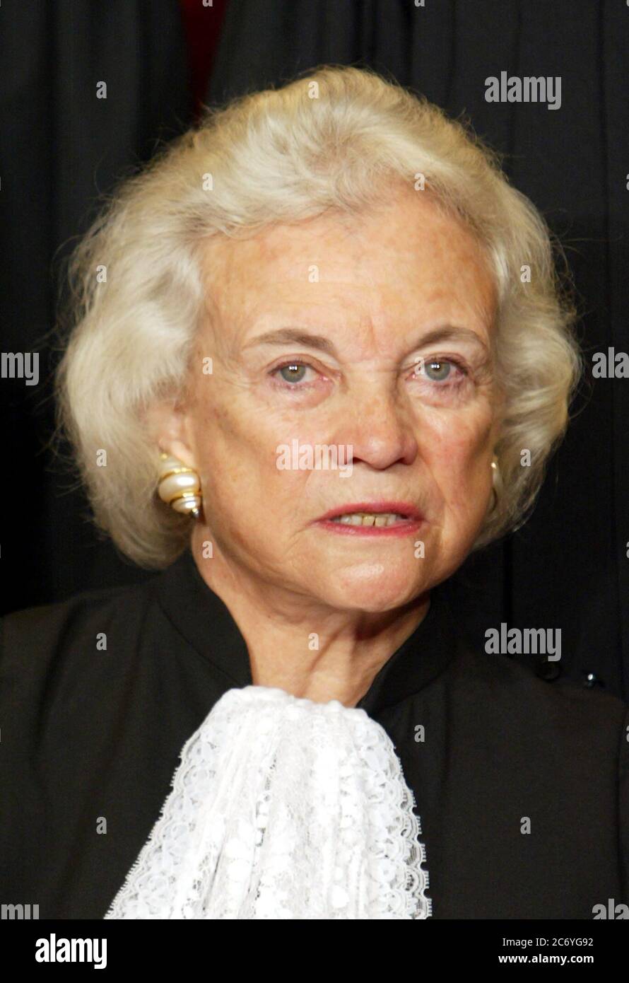 Associate Justice of the United States Supreme Court Sandra Day O'Connor poses during a group portrait session with the members of the United States Supreme Court, at the Supreme Court Building in Washington, DC on December 5, 2003. O'Connor made history as the first woman on the high court when former United States President Ronald Reagan nominated her.  She took her seat September 25, 1981. Credit: Mark Wilson / Pool via CNP / MediaPunch Stock Photo