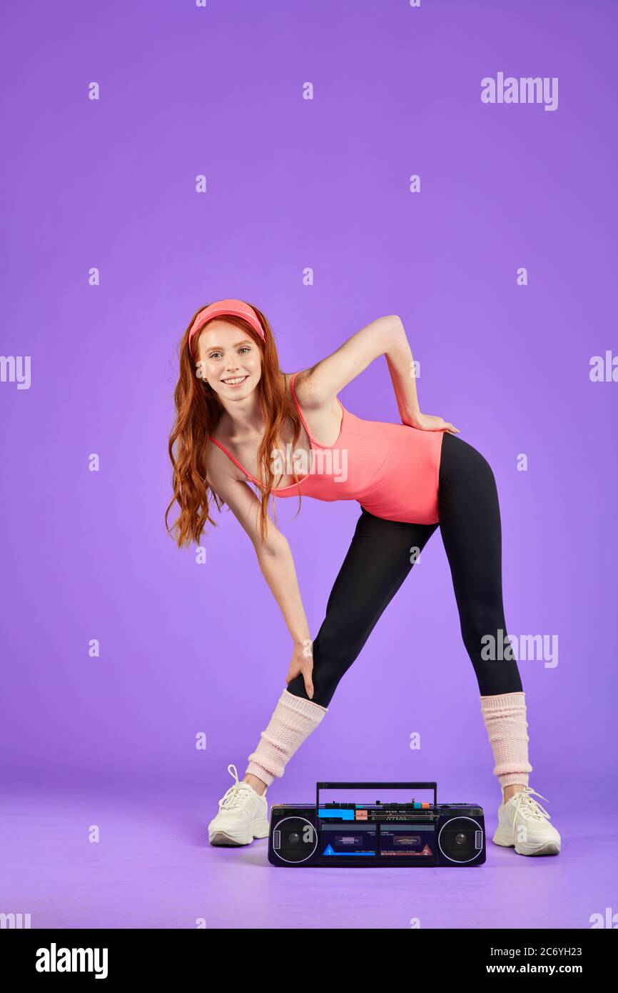 Girl With Red Hair Warm Up At Training Doing Stretching Exercises Leans Aside Works Out At Home Watching Training Class On Tv And Listens To Music Stock Photo Alamy Girl With Red Hair Warm Up At Training Doing Stretching Exercises Leans Aside Works Out At Home Watching Training Class On Tv And Listens To Music Stock Photo Alamy