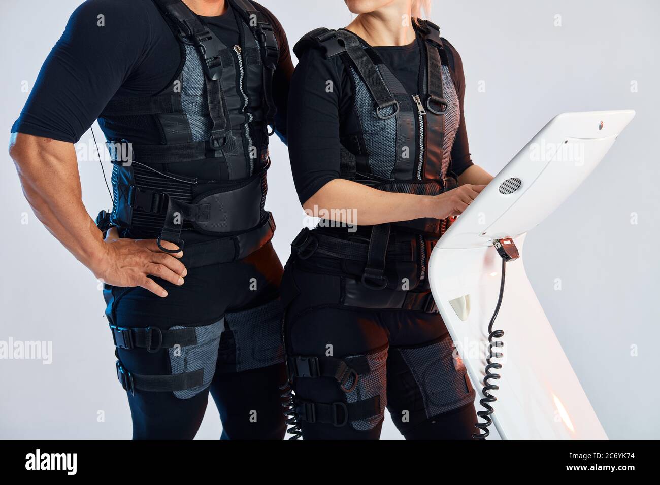 man and woman body wearing suits for electro muscle stimulation EMS ...