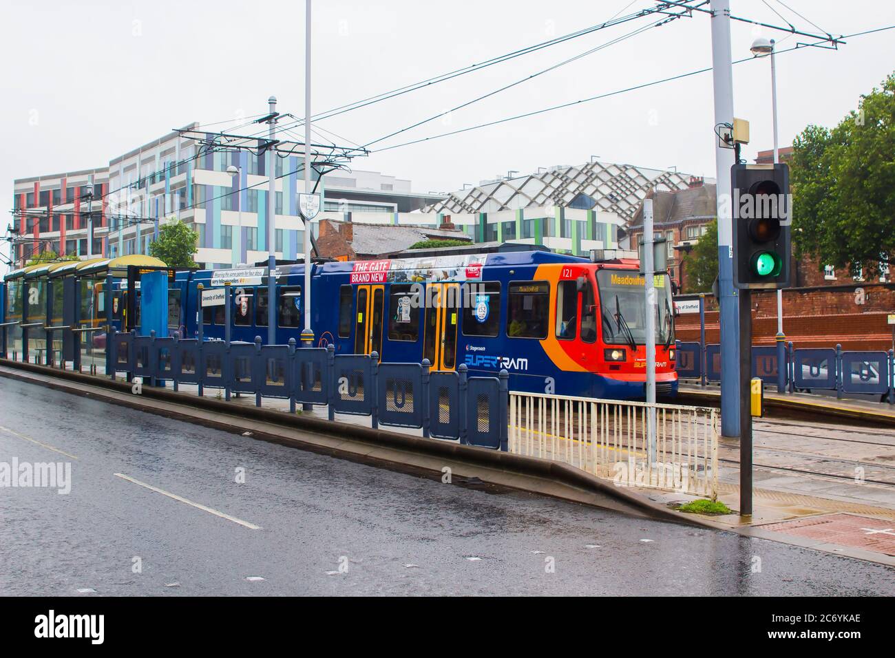 8 July 2021 This inward bound Sheffield Stagecoach Supertram at a stop on a wet misty day is one of a fleet of Siemens-Duewag Supertrams in operation Stock Photo