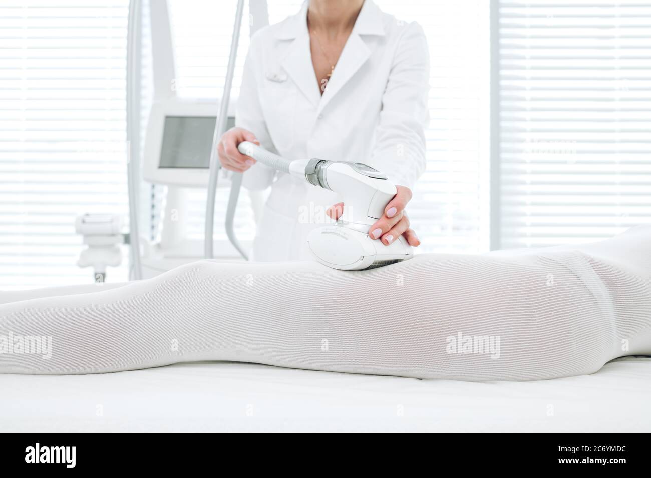 LPG massage procedure for cellulite and fat reduction. Cropped woman in