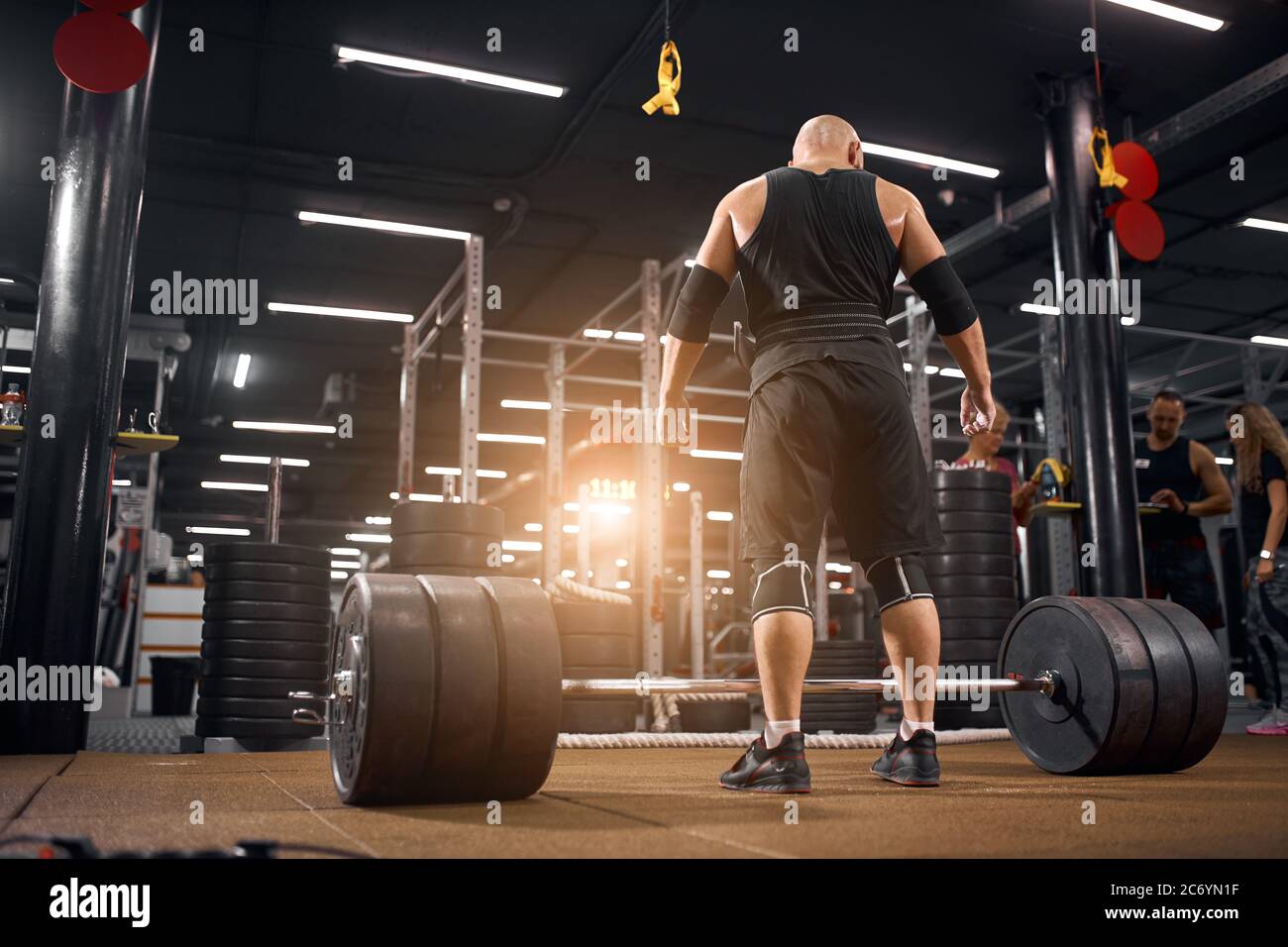 man of powerlifting squat competition preparing for deadlift, standing