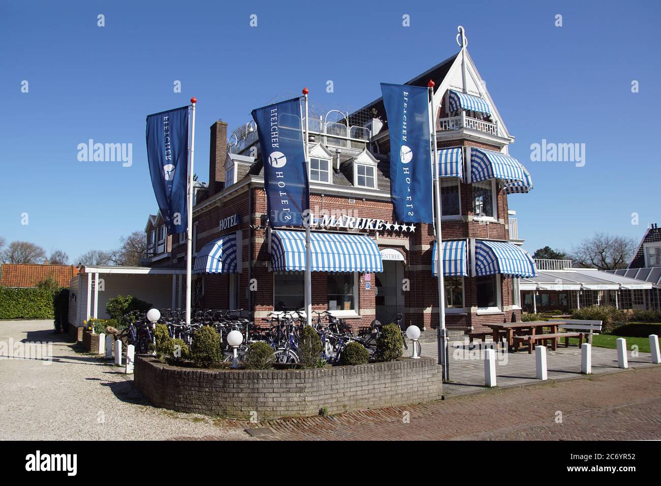 Hotel Marijke with bicycles that can be rented in the Dutch tourist village of Bergen in North Holland. In March quiet because of the coronavirus. Stock Photo