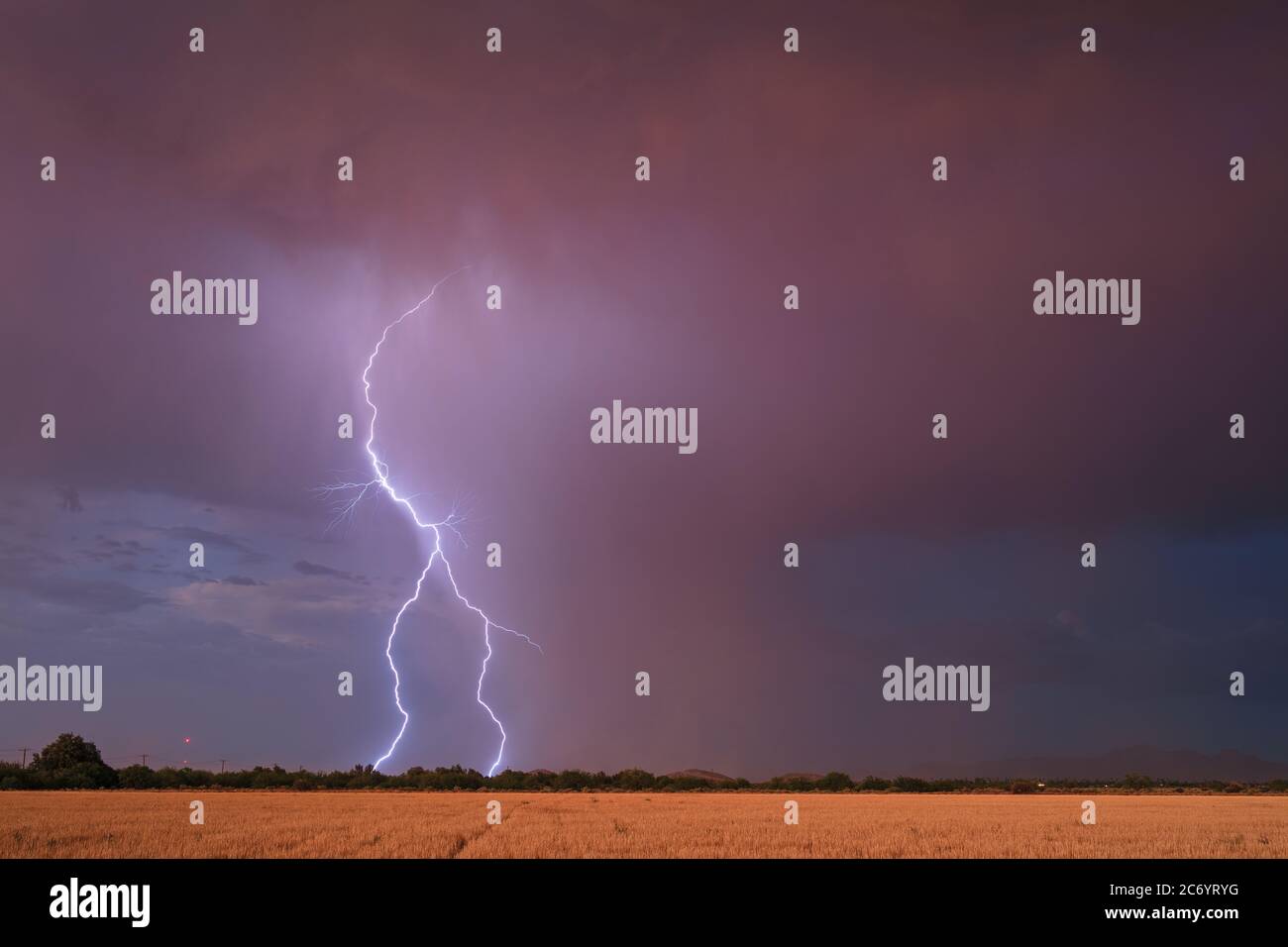Dark, moody sky with a monsoon lightning storm over Eloy, Arizona Stock Photo