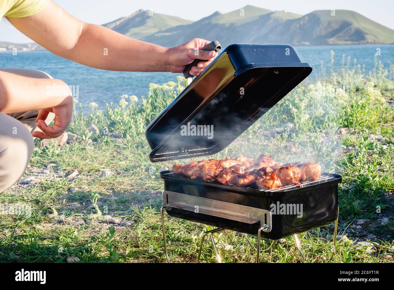 Chicken barbecue on seacoast Stock Photo