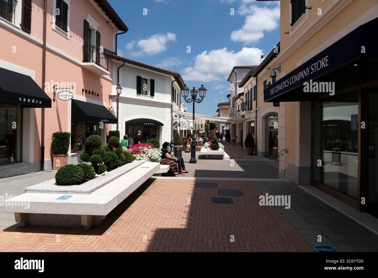 SERRAVALLE SCRIVIA, ITALY - JULY 12 2020 - Lot of people buying fashion items at the beginning of designer outlet Sale season wearing mask after covid Stock Photo