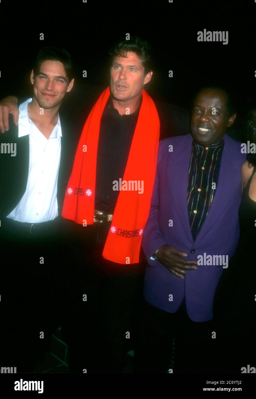 Universal City, California, USA 15th December 1995 (L-R) Actor Eddie Cibrian, actor David Hasselhoff and singer Lou Rawls attend Baywatch & Baywatch Nights Holiday Party on December 15, 1995 at B.B. King's Blues Club in Universal City, California, USA. Photo by Barry King/Alamy Stock Photo Stock Photo