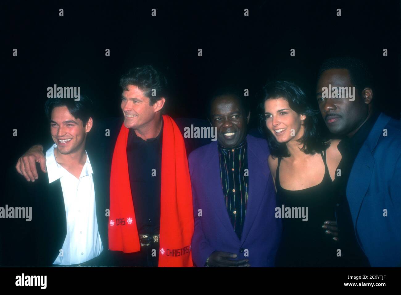 Universal City, California, USA 15th December 1995 (L-R) Actor Eddie Cibrian, actor David Hasselhoff, singer Lou Rawls, actress Angie Harmon and actor Gregory Alan Williams attend Baywatch & Baywatch Nights Holiday Party on December 15, 1995 at B.B. King's Blues Club in Universal City, California, USA. Photo by Barry King/Alamy Stock Photo Stock Photo