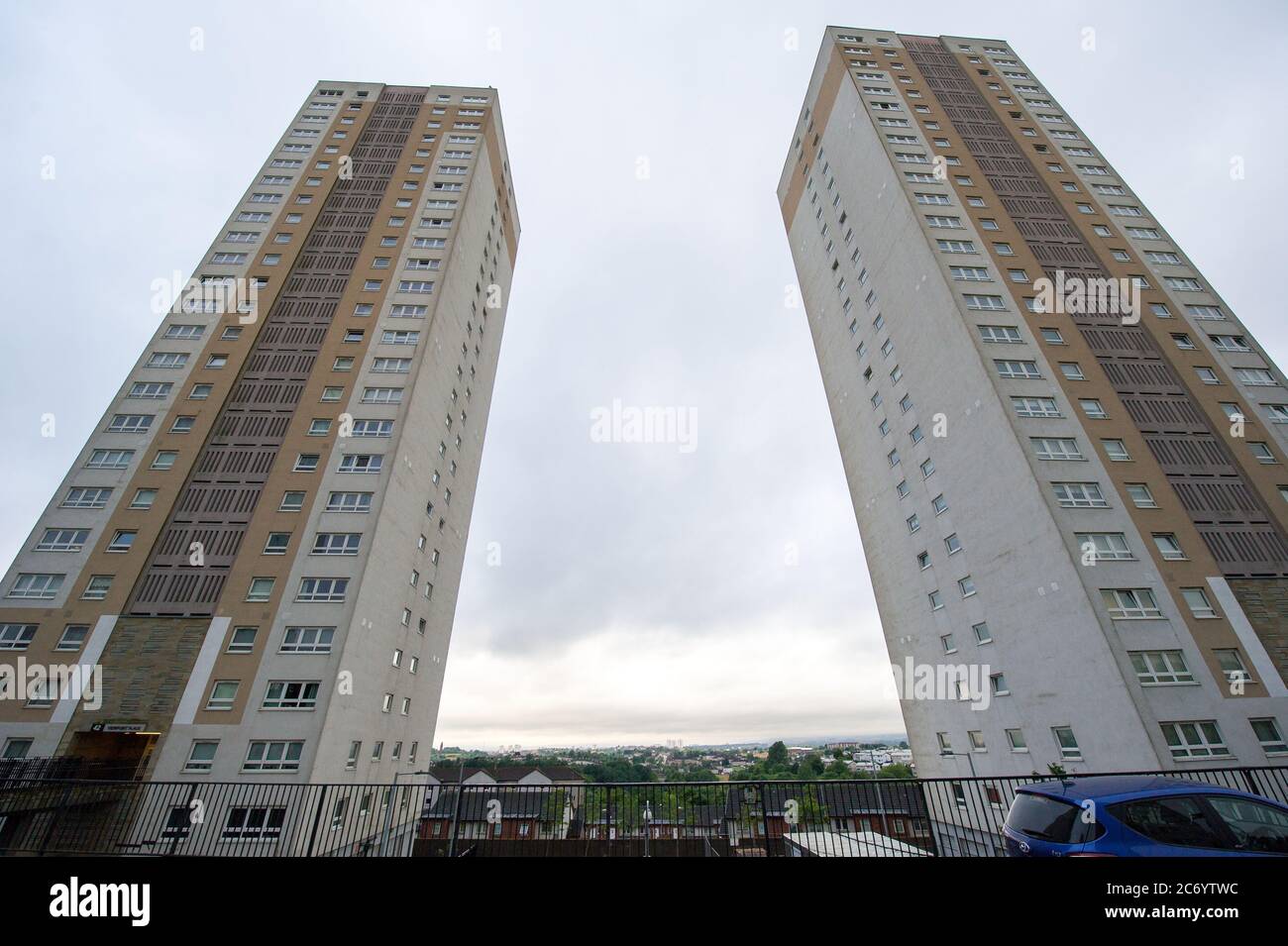 Glasgow Scotland, UK. 13th July, 2020. Pictured: High-rise Flats in Stobhill area of Glasgow reach high into the sky seemingly scratching the underside of the dense grey cloud base which hangs over the whole of Glasgow this morning. Credit: Colin Fisher/Alamy Live News Stock Photo